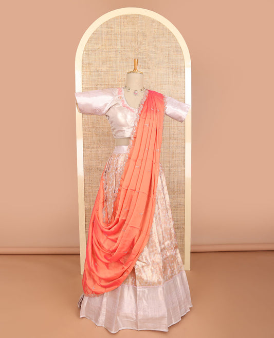 Light orange floral jacquard half saree with contrast zari design border, floral embroidered blouse & floral embroidery dhavani