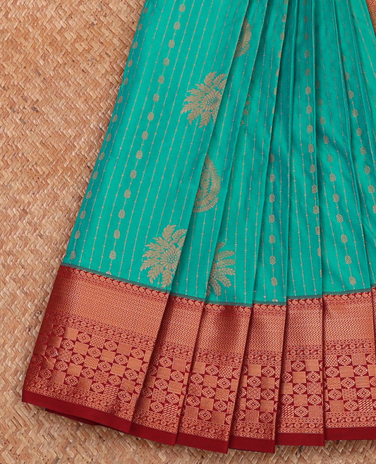 Green floral buttas and striped budget silk saree, contrast traditional zari border, and zari-rich jaal pallu