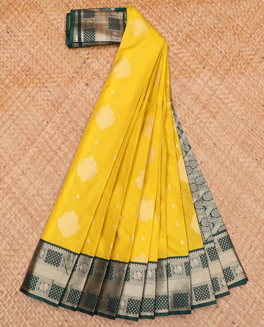 Yellow Budget Silk Saree, Delicately Woven with Zari Buttas All Over Its Body, Complemented by a Contrast Traditional Zari Design Border of Peacock Designs, Pallu Features Jaal Designs, and Paired with a Contrast Blouse