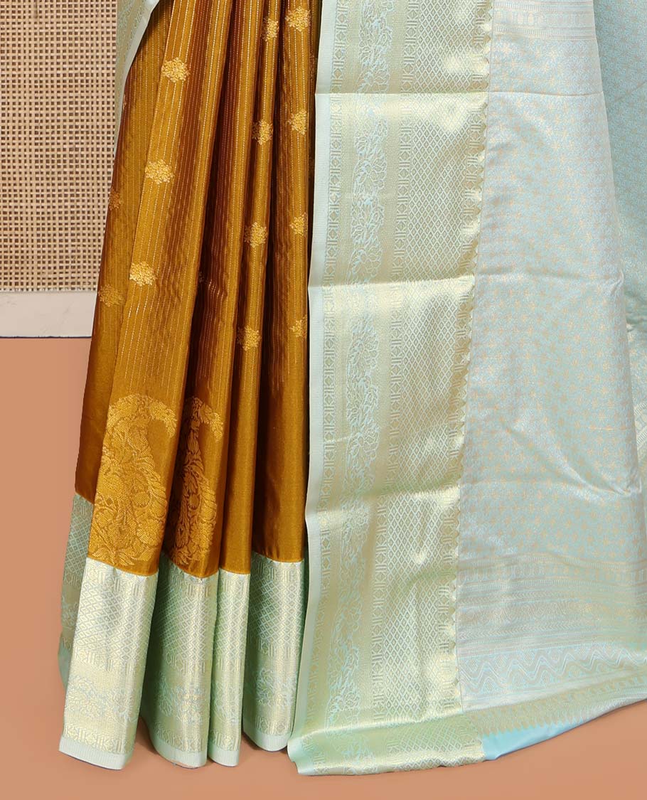 Mustard Budget Silk Saree, Detailed with Zari Buttas, Stripes and Paisleys on Its Body, Complemented by a Contrast Traditional Zari Design Border, Opulently Embellished Pallu, and Paired with a Contrast Blouse