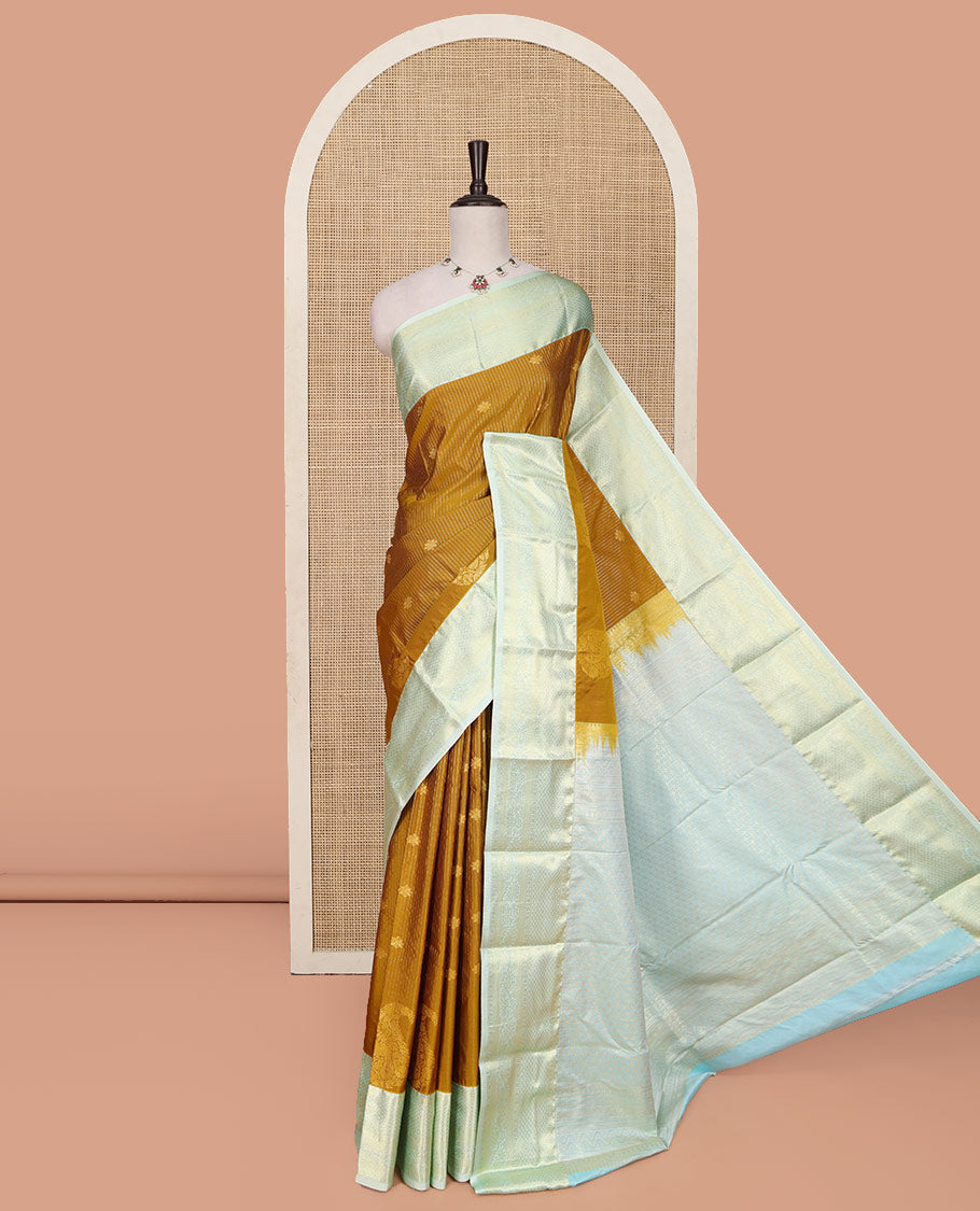 Mustard Budget Silk Saree, Detailed with Zari Buttas, Stripes and Paisleys on Its Body, Complemented by a Contrast Traditional Zari Design Border, Opulently Embellished Pallu, and Paired with a Contrast Blouse