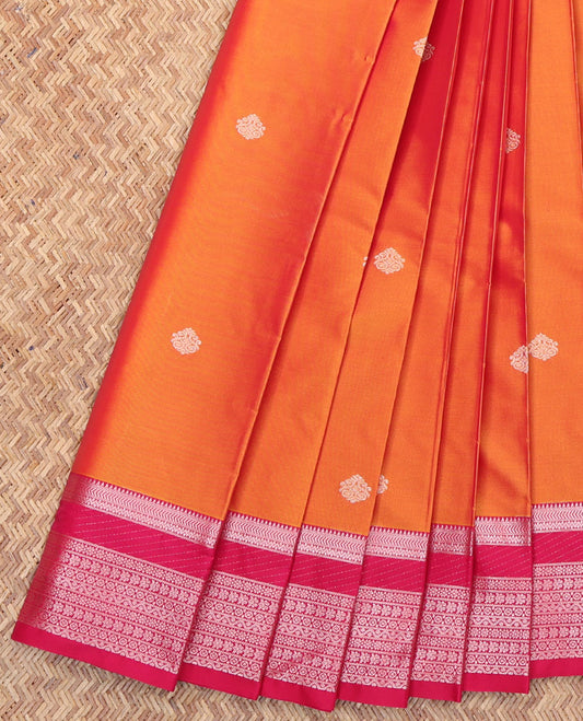 Orange Budget Silk Saree, Subtly Detailed with Zari Buttas All Over Its Body, Complemented by a Contrast Traditional Zari Design Border, Geometric-Patterned Pallu, and Paired with a Contrast Blouse