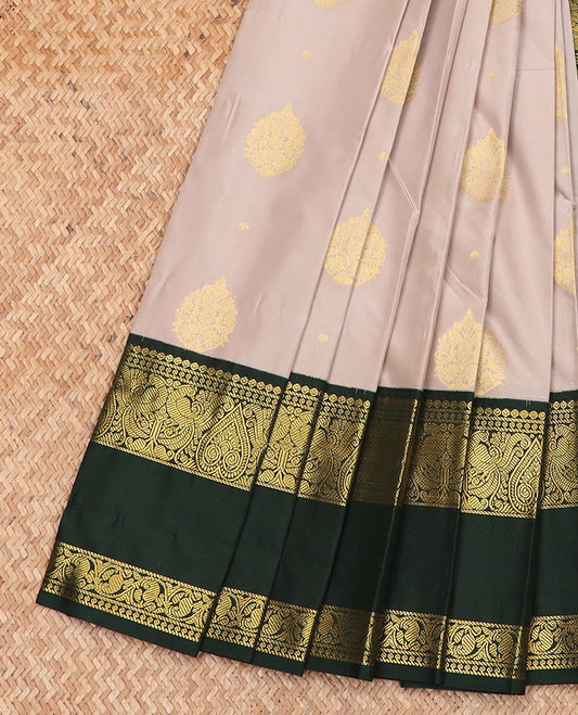 Beige zari buttas gift saree, contrast traditional zari design rettai pettu border, and intricate pallu