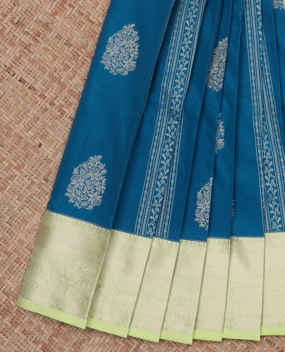 Blue Budget Silk Saree Steeped with Floral Designs Across Its Body, Highlighted with a Contrast Traditional Paisleys Zari Design Border, Mughal-Style Pallu, and a Contrast Zari-Bordered Blouse