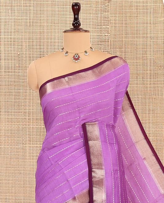 Purple Assam Silk Saree, Gracefully Embellished with Zari Stripes, Complemented by Contrast Zari Border, Pallu Features Zari Stripes, and Paired with a Contrast Blouse