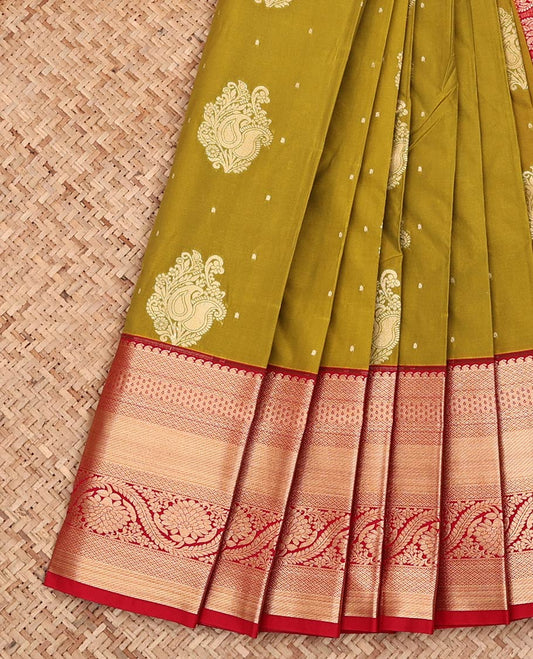 Green Budget Silk Saree, Gleamed Up with Zari Buttas on Its Body, Complemented by a Contrast Traditional Zari Border of Floral Creeper Designs, Intricately Designed Pallu, and Paired with a Contrast Blouse