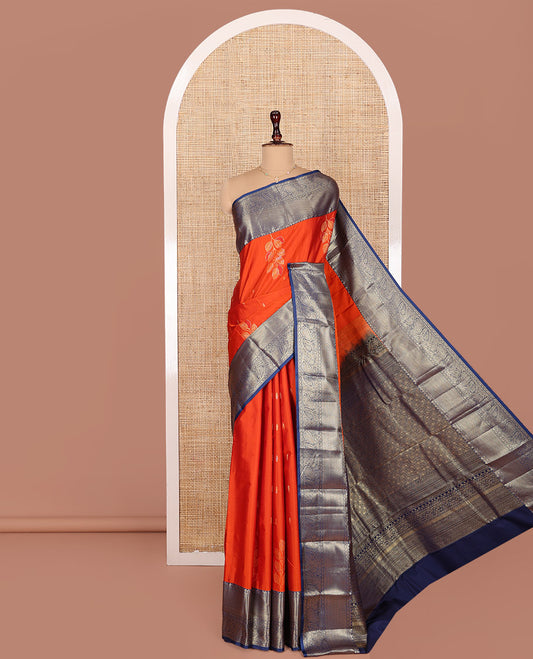 Orange Budget Silk Saree, Decked Up with Zari Buttas and Leaf Buttas on Its Body, Complemented by a Contrast Traditional Zari Designs Border, Pallu of Jaal Designs, and Paired with a Contrast Blouse