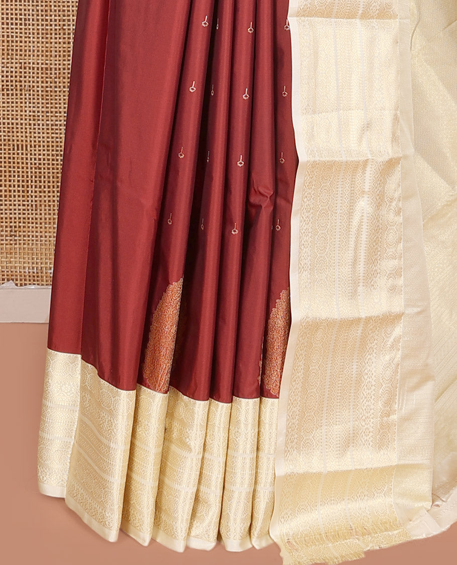 Rust Budget Silk Saree, Gracefully Embellished with Zari Buttas on Its Body, Complemented by a Contrast Traditional Zari Design Border, Subtly Sparkled Pallu, and Paired with a Contrast Blouse