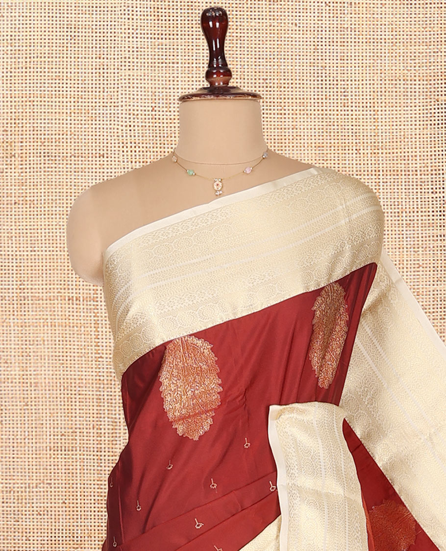 Rust Budget Silk Saree, Gracefully Embellished with Zari Buttas on Its Body, Complemented by a Contrast Traditional Zari Design Border, Subtly Sparkled Pallu, and Paired with a Contrast Blouse