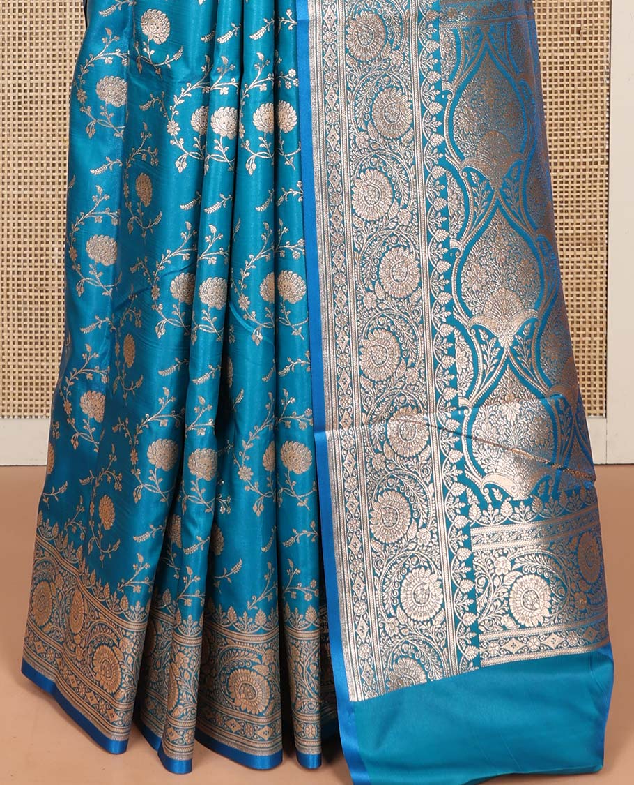 Blue Semi-Banaras Saree, Majestically Detailed with Floral Jaal Jacquard on Its Body, Highlighted by a Floral Creeper Design Border, Intricately Designed Zari Pallu, and Paired with a Matching Blouse