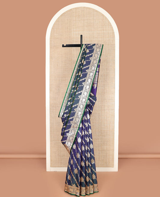 Blue jacquard banarasi silk saree, floral creeper design border, and pallu of Mughal-inspired intricate motifs