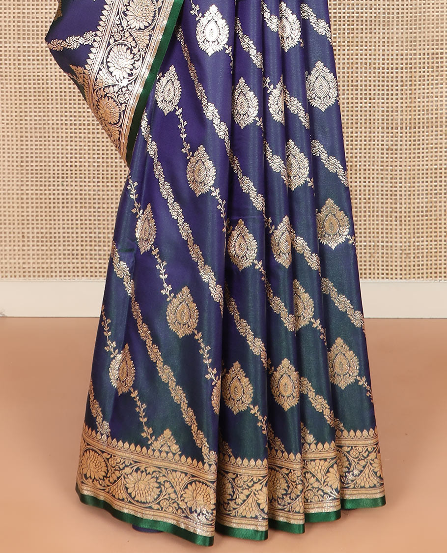 Blue jacquard banarasi silk saree, floral creeper design border, and pallu of Mughal-inspired intricate motifs