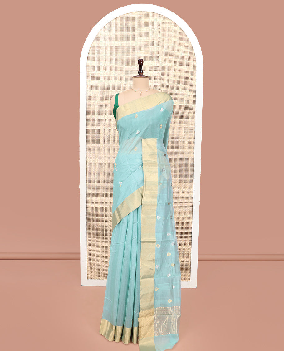 Blue Chanderi Cotton Saree, Gleamed Up with Floral Buttas All Over Its Body, Highlighted by a Bavanji Border, Pallu Steeped with Zari Stripes, and Paired with a Matching Blouse