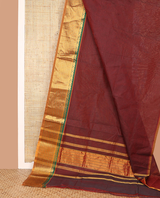 Maroon Plain Venkatagiri Cotton Saree, Complemented by a Contrast Traditional Zari Design Border, Gleaming Zari-Striped Pallu, and Comes Without a Blouse