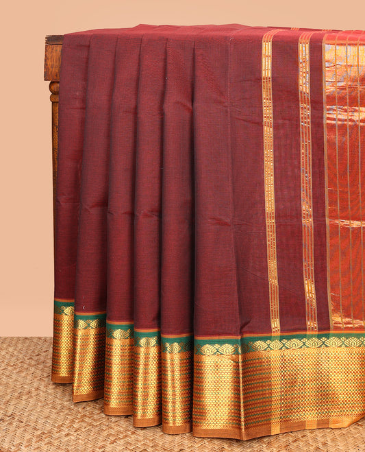 Maroon Plain Venkatagiri Cotton Saree, Complemented by a Contrast Traditional Zari Design Border, Gleaming Zari-Striped Pallu, and Comes Without a Blouse