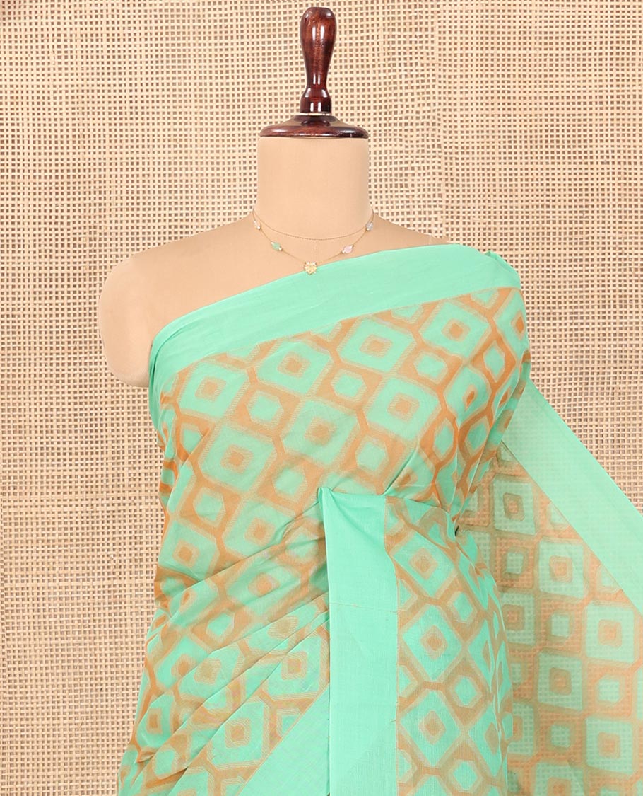 Green Coimbatore Cotton Saree, Accentuated with Diamond Designs on Its Body, Subtle Self-Border, Pallu of Temple Patterns, and Paired with a Matching Blouse
