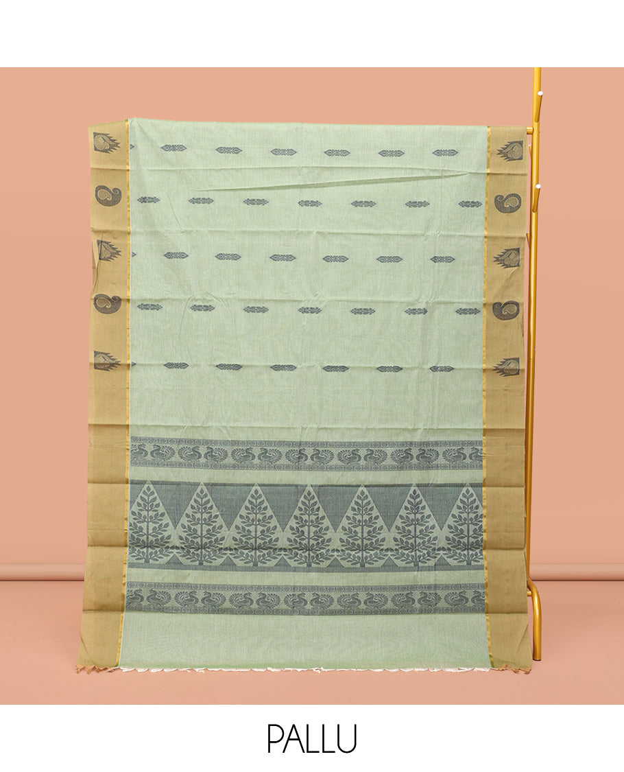Green Kanchi Cotton Saree Features Buttas on Its Body, Contrast Temple and Paisley Border, Intricately Designed Pallu, and a Matching Blouse