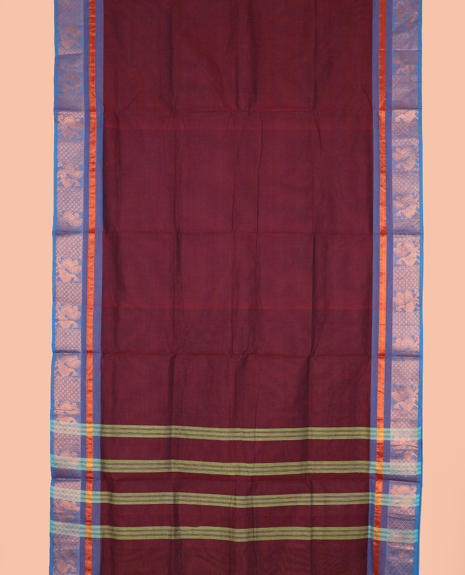 Maroon plain design nine-yard cotton saree, contrast traditional zari border, and pallu of stripes