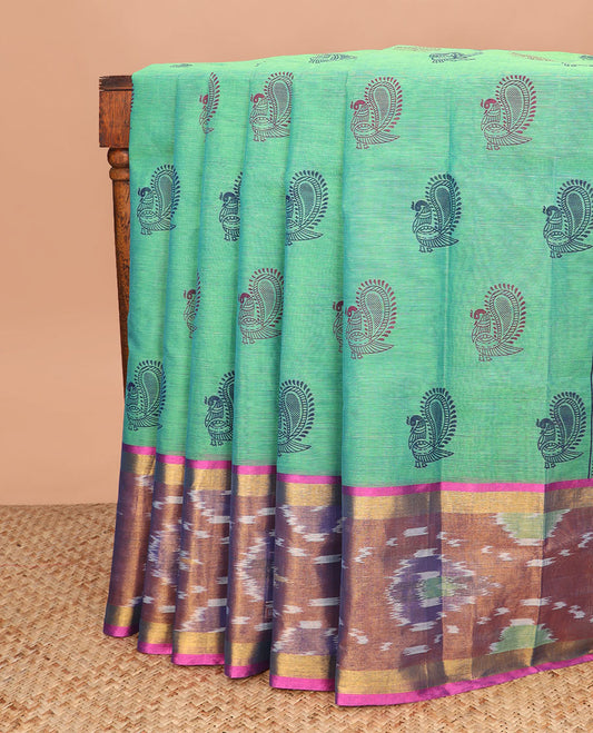 Green peacock printed Andhra cotton saree, contrast ikkat zari border, and pallu of peacock, and paisleys