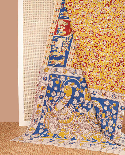 Yellow batik floral machine-printed cotton saree, contrast printed border, and pallu of kalamkari peacock print