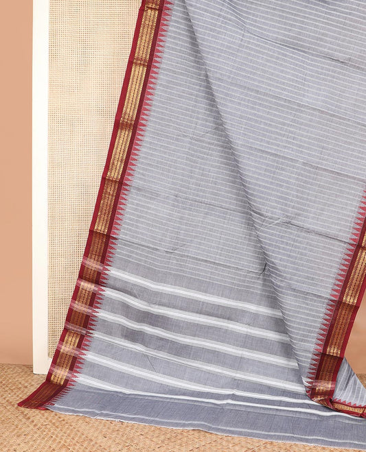 Grey striped Chettinad cotton saree, contrast traditional zari temple border, and striped pallu