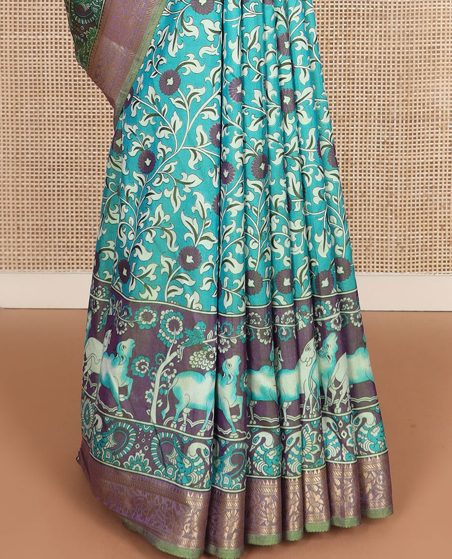 Blue floral vine patola silk saree, contrast traditional zari border and pallu of Pichwai cow and peacock motifs