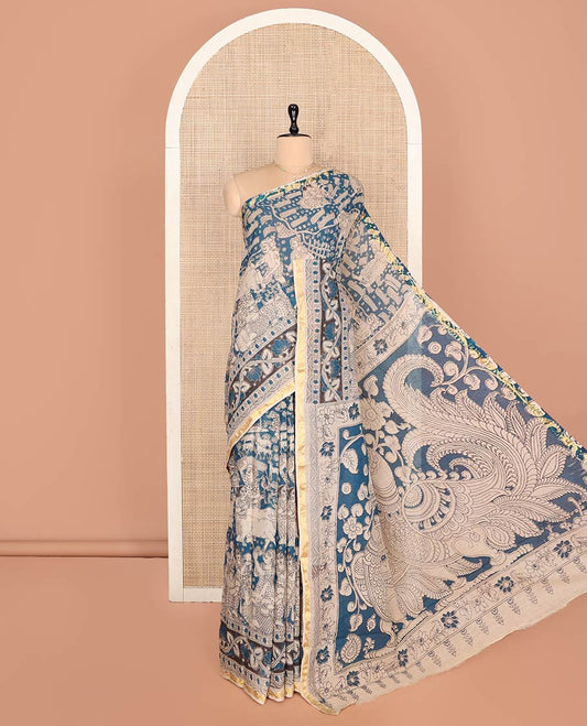 Blue Machine-Printed Kalamkari Cotton Saree Features Human Motifs, a Piping Border, Pallu of Peacocks, and a Matching Blouse