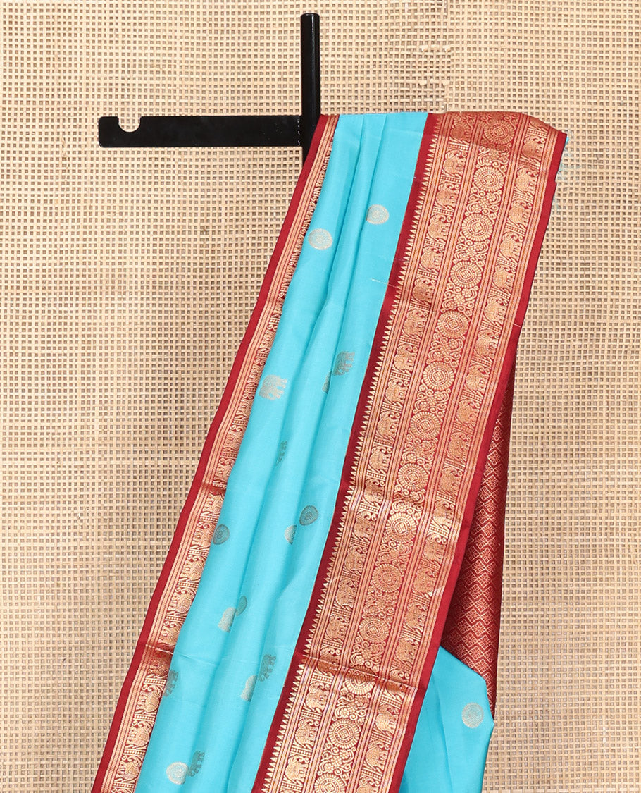 Blue Vasundhara Silk Saree, Embellished with Mayil and Yaanai Buttas Across Its Body, Complemented by a Contrast Korvai Border of Rekku, Banaras, Yaanai, and Chakram Designs, Gleaming Jaal Pallu, and Paired with a Contrast Blouse