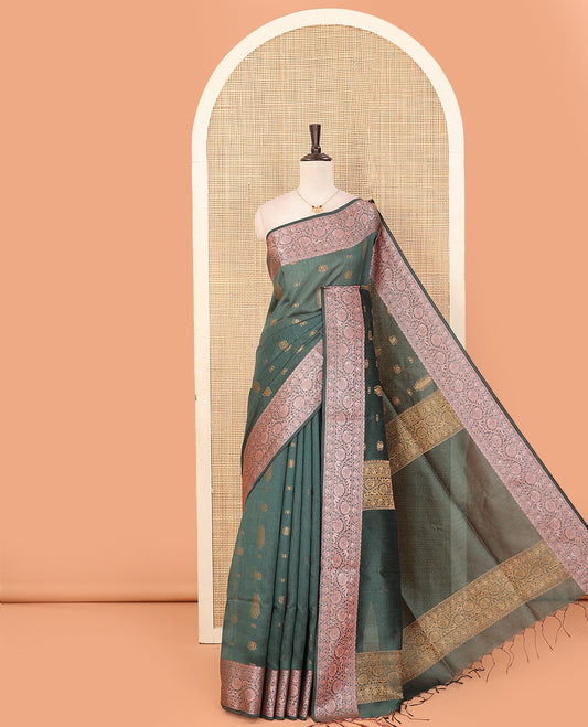 Green buttas dupion saree, floral creeper zari design border, and plain pallu flanked by floral creeper designs