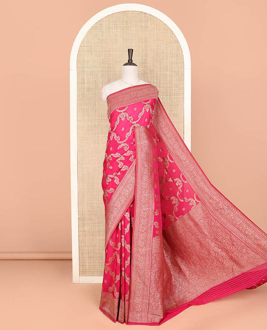 Pink Fancy Georgette Meticulously Designed with Zari Jacquard Designs, Zari Woven Border of Paisley Designs, Zari-Decked Up Pallu of Paisley Jaal Designs, and Paired with a Matching Blouse