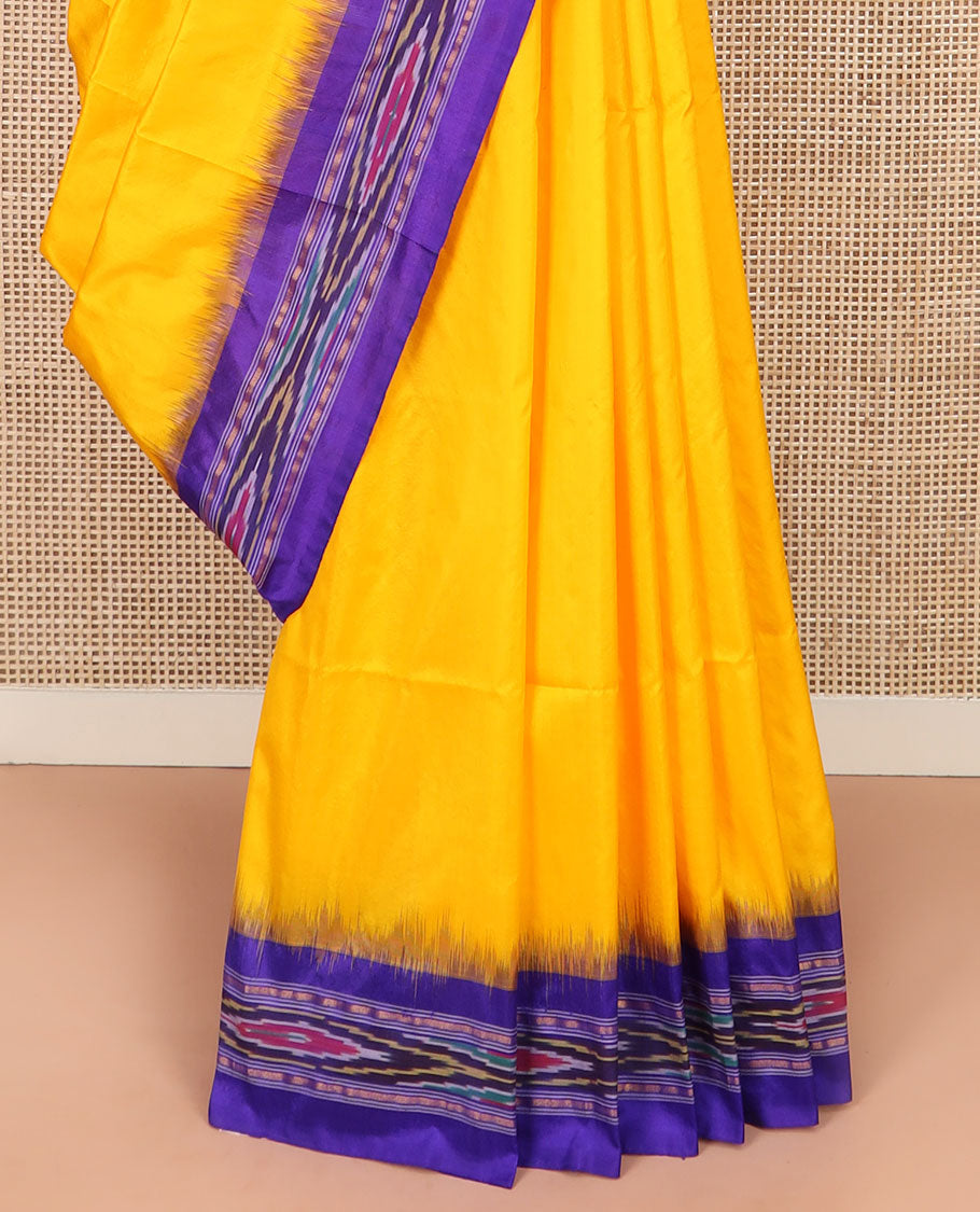 Bright Yellow Plain Ikkat Silk Saree with a Contrast Violet Border Dazzled by a Hazy Ikkat Weave, Featuring a Pallu Flanked by Stripes and Ikkat Texture