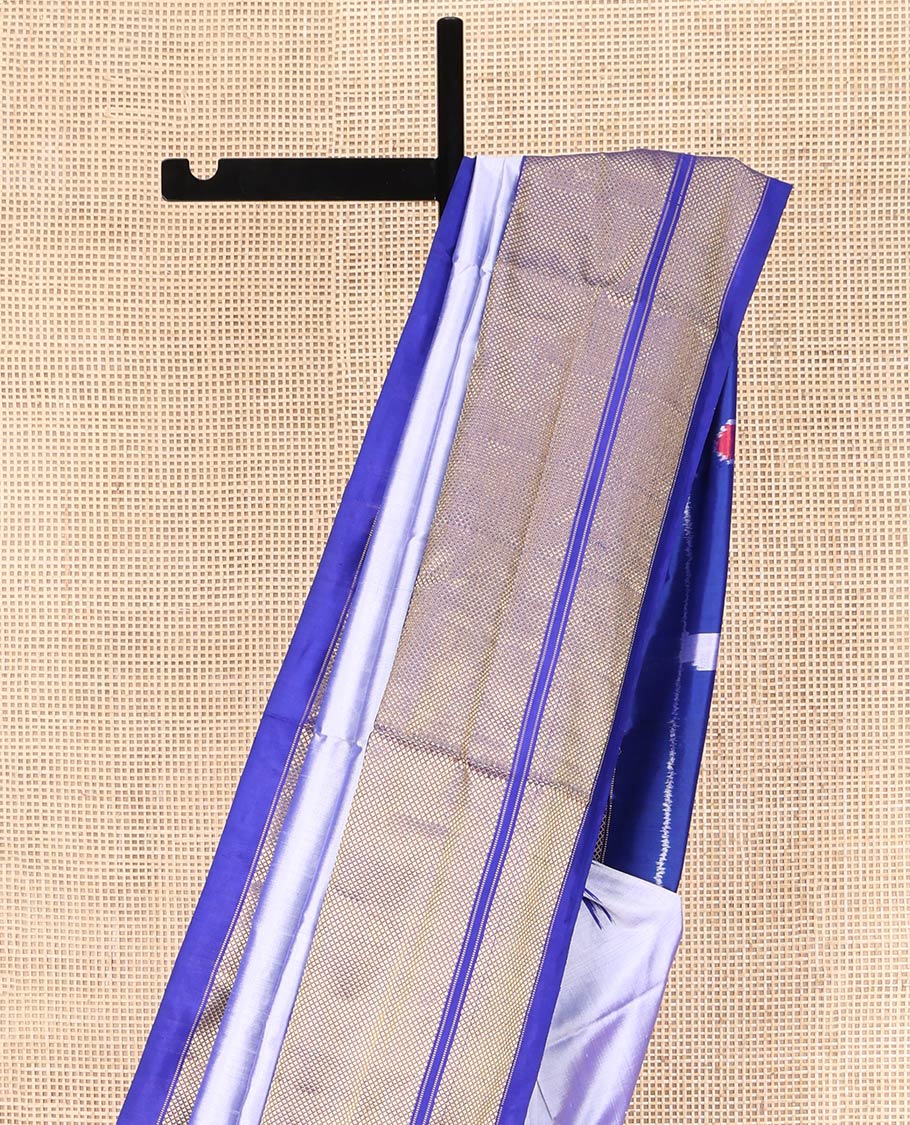 Grey Plain Ikkat Silk Saree, Complemented by a Contrast Temple Border of Diamond Designs, Pallu Features Ikkat Fauna Designs, and Paired with a Contrast Blouse