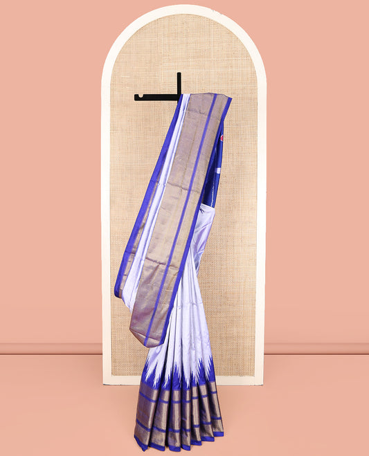 Grey Plain Ikkat Silk Saree, Complemented by a Contrast Temple Border of Diamond Designs, Pallu Features Ikkat Fauna Designs, and Paired with a Contrast Blouse