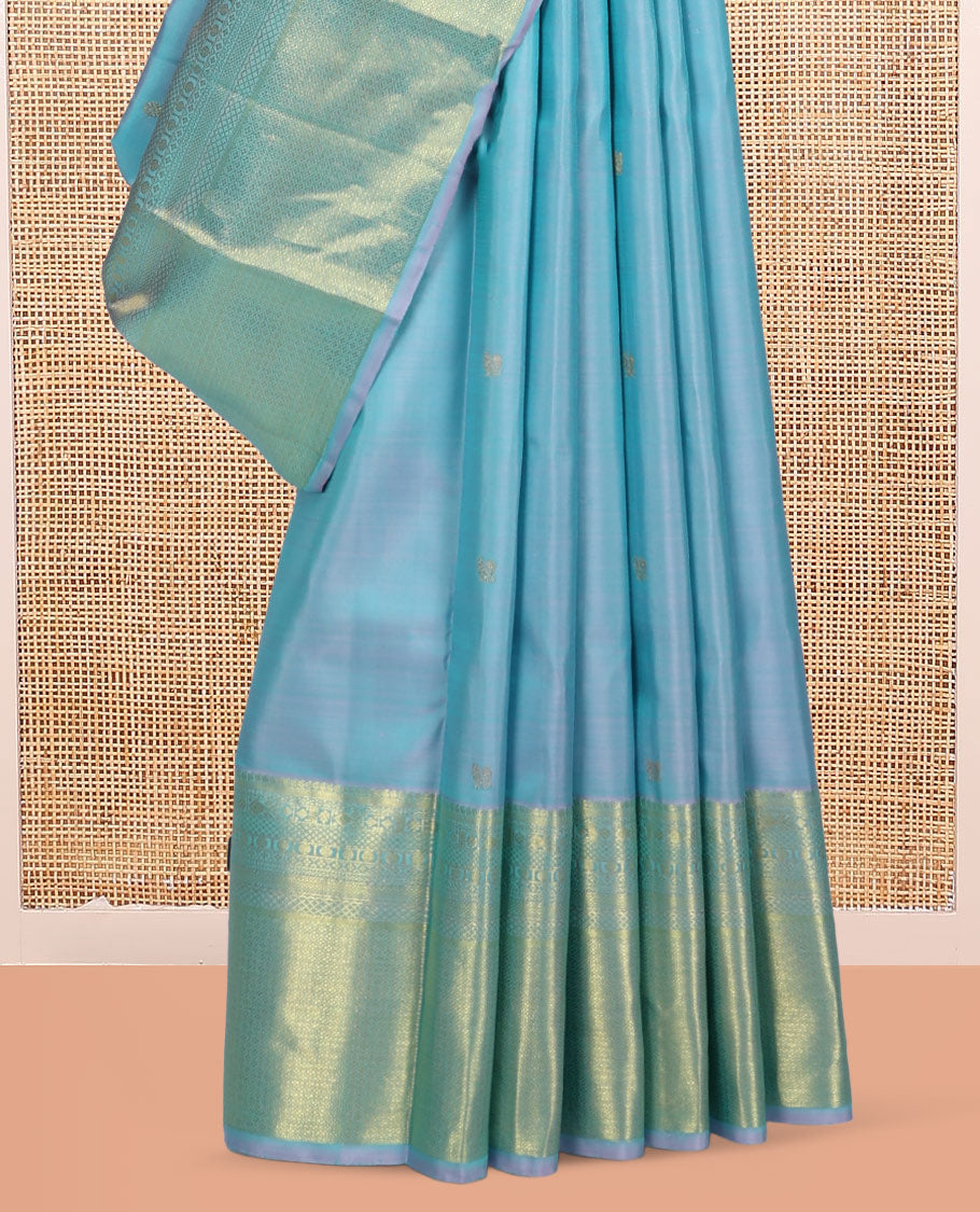 Blue Kanchipuram Silk Saree, Sparsely Woven with Zari Buttas, Highlighted by Zari Border of Manga, Neli, Mayil Kann, Kamalam, Poun, and Jaal Design, Zari Design Pallu, and a Matching Blouse