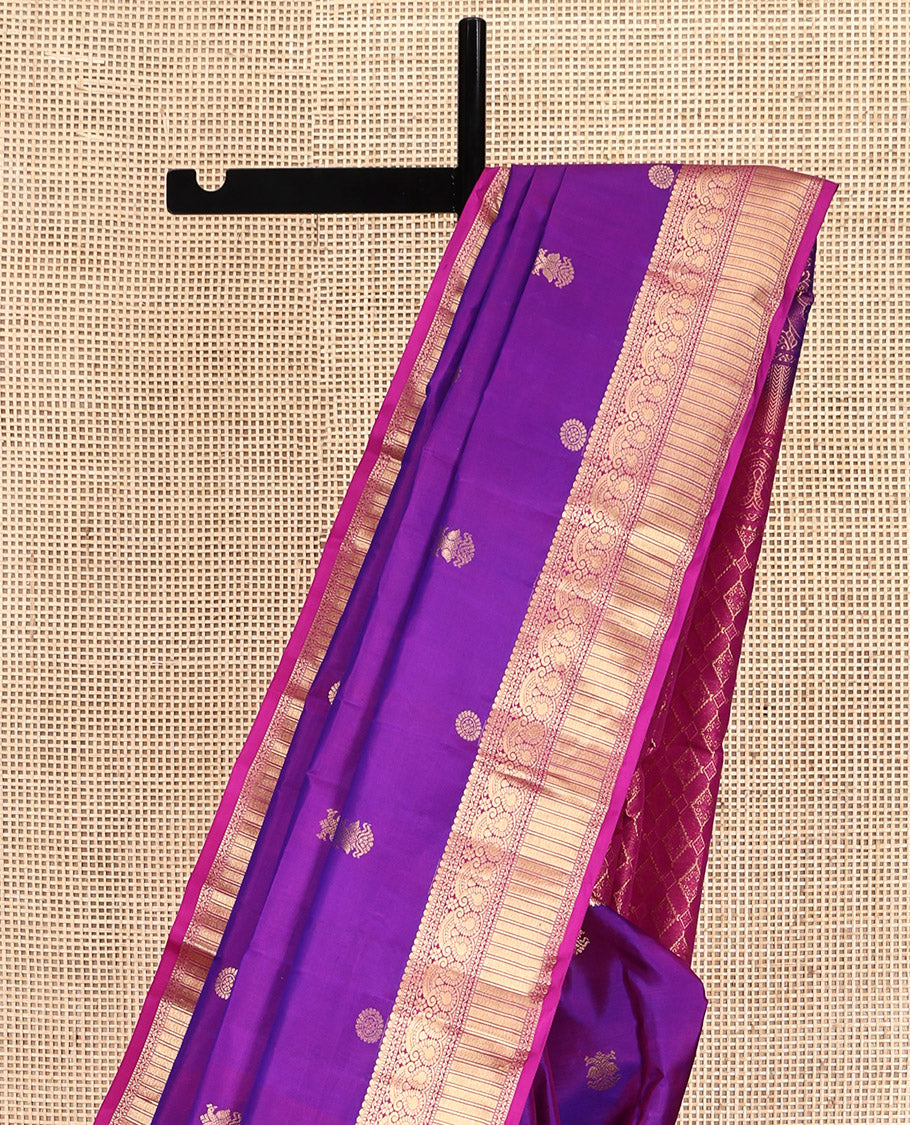 Purple Kanchipuram Silk Saree, Detailed with Chakram and Iruthalai Pakshi Buttas All Over Its Body, Complemented by a Contrast Border of Salngai, Muthu, Neli, Manga, and Kathir Designs, Intricately Designed Pallu, and Paired with a Contrast Blouse