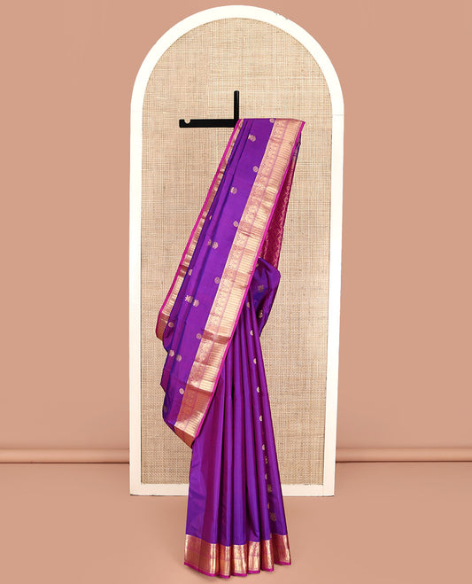 Purple Kanchipuram Silk Saree, Detailed with Chakram and Iruthalai Pakshi Buttas All Over Its Body, Complemented by a Contrast Border of Salngai, Muthu, Neli, Manga, and Kathir Designs, Intricately Designed Pallu, and Paired with a Contrast Blouse
