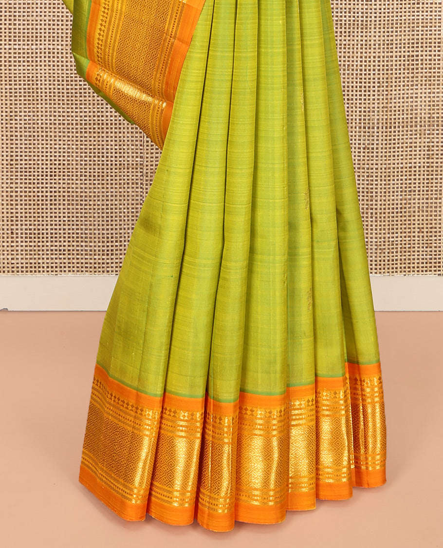 Green Kanchipuram Silk Saree, Adorned with Zari Buttas, Complemented by a Contrast One-Sided Border of Panner Sombu, Banaras, Muthu, and Jaal Designs, Zari Design Pallu, and No Blouse