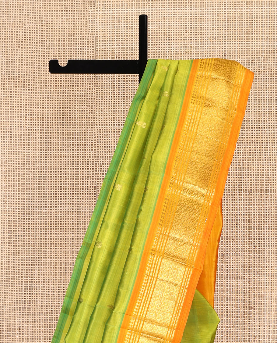 Green Kanchipuram Silk Saree, Adorned with Zari Buttas, Complemented by a Contrast One-Sided Border of Panner Sombu, Banaras, Muthu, and Jaal Designs, Zari Design Pallu, and No Blouse