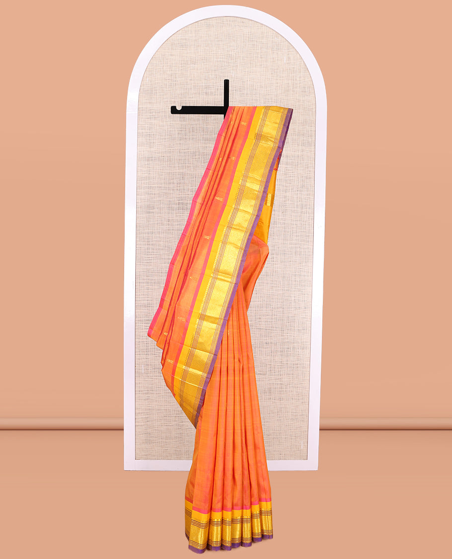 Orange Kanchipuram Silk Saree, Finely Crafted with Zari Buttas, a Contrast One-sided Border of Panner Sombu, Banaras, Muthu, and Jaal Designs, Zari Woven Pallu, and No Blouse