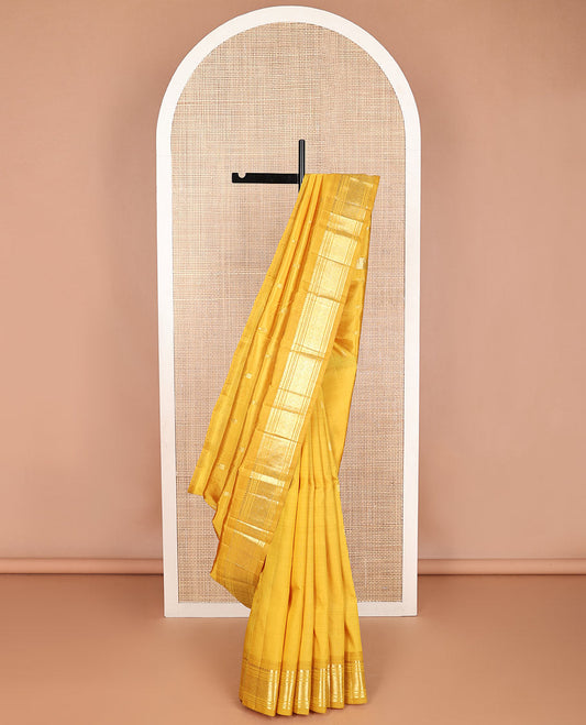 Mustard buttas kancheepuram silk saree with contrast border of thilakam mokku, banaras, muthu,checked design & zari design pallu