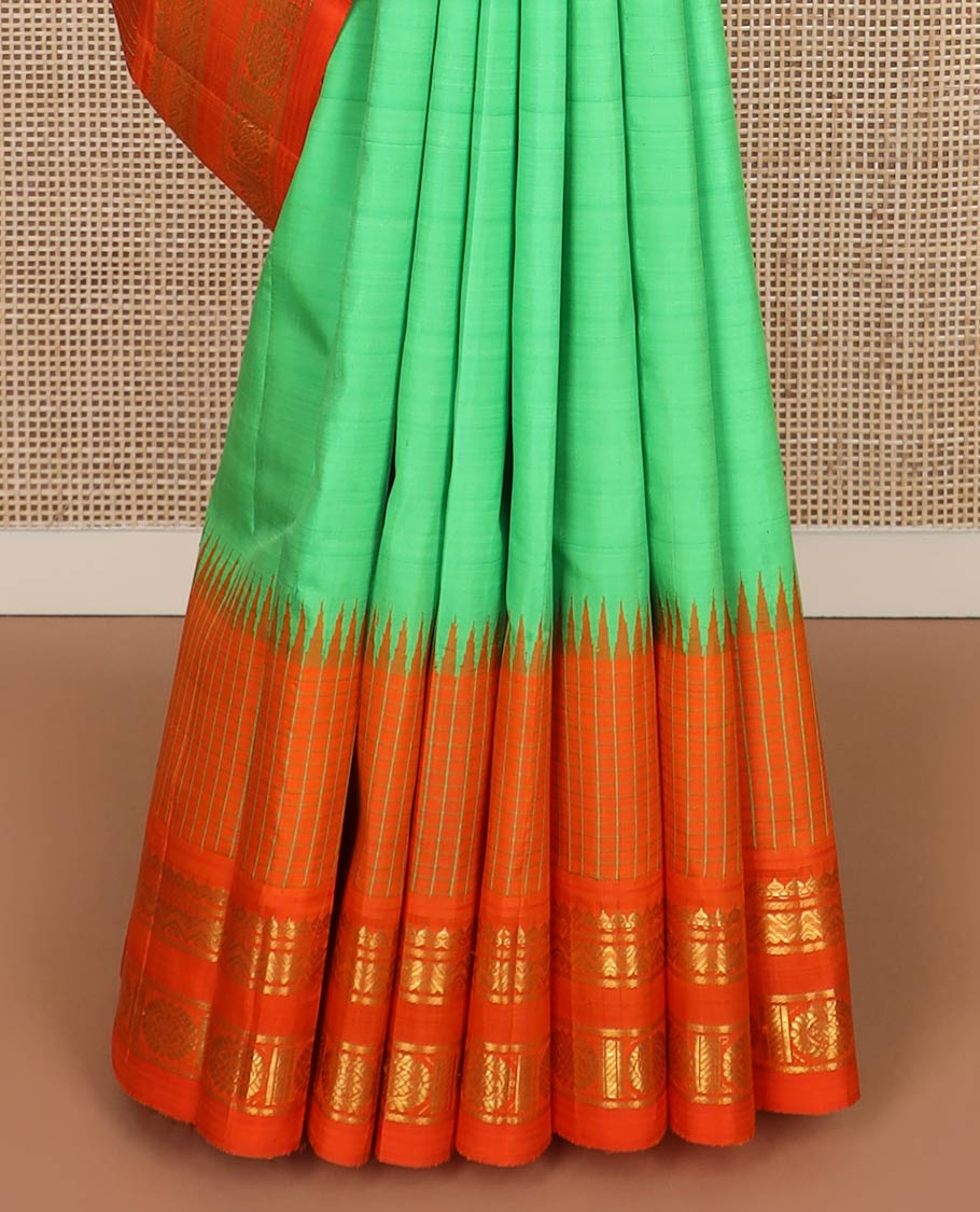 Green zari buttas silk saree, contrast one-sided temple rettai pettu border of salangai,banaras,rettai neli & chakram & intricate pallu