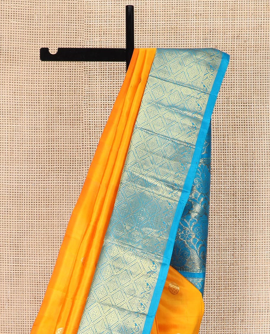 Yellow Kanchipuram Silk Saree Meticulously  Woven with Zari Buttas All Over Its Body, Complemented by a Contrast One-Sided Korvai Border of Jaal Designs, Richly Woven Pallu of Intricate Motifs in Zari, and Comes Without a Blouse