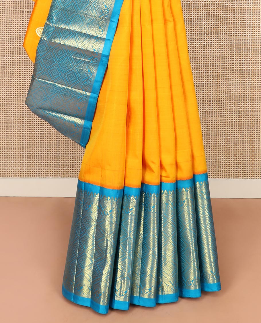 Yellow Kanchipuram Silk Saree Meticulously  Woven with Zari Buttas All Over Its Body, Complemented by a Contrast One-Sided Korvai Border of Jaal Designs, Richly Woven Pallu of Intricate Motifs in Zari, and Comes Without a Blouse