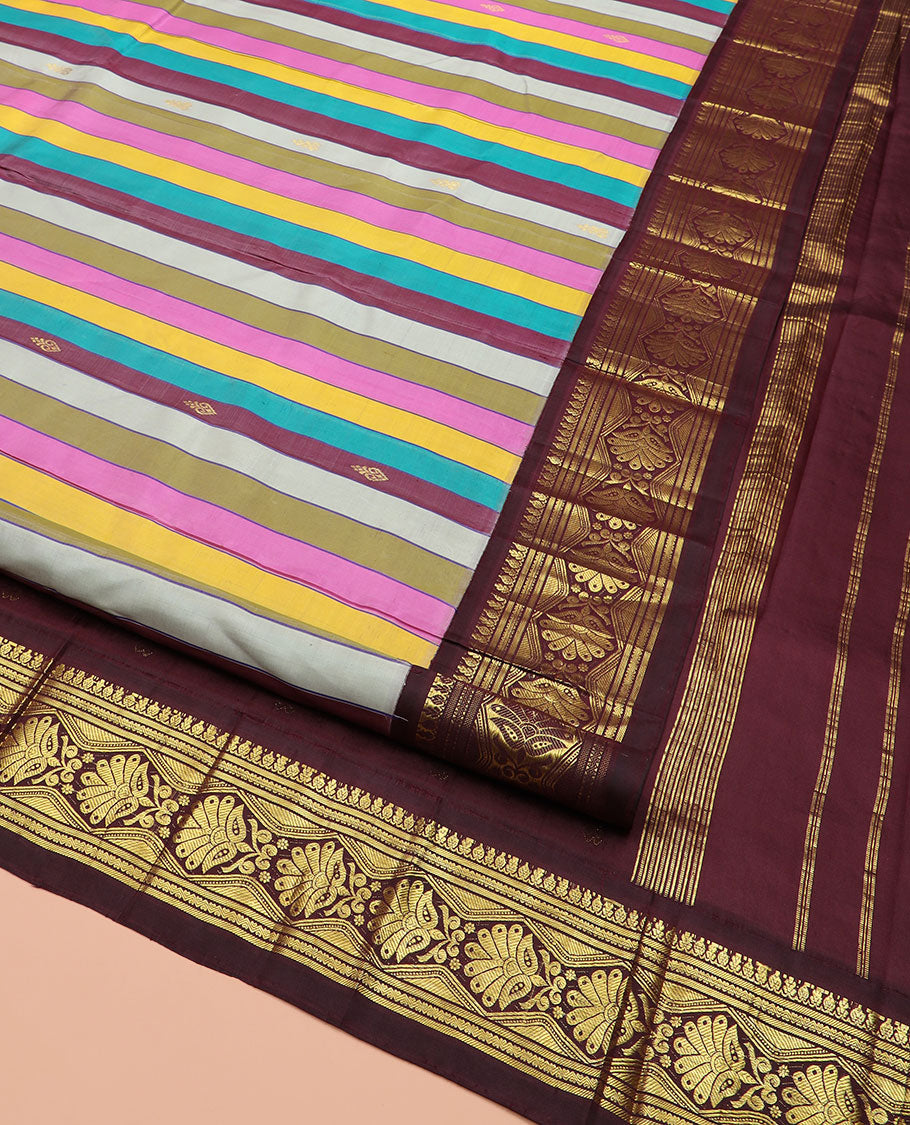 Multi-Color Kanchipuram Silk Saree Majestically Detailed with Stripes and Zari Buttas, Highlighted by Contrast One-Sided Korvai Border of Traditional Zari Designs, Grandly Woven Pallu of Zari Design, and Comes Without a Blouse