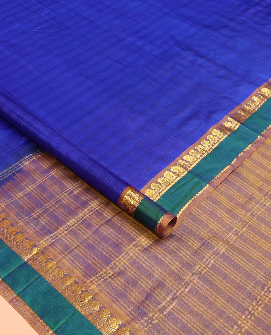 Royal blue checked Kanchipuram silk saree, contrast border of manga, neli, and diamond designs, and striped pallu
