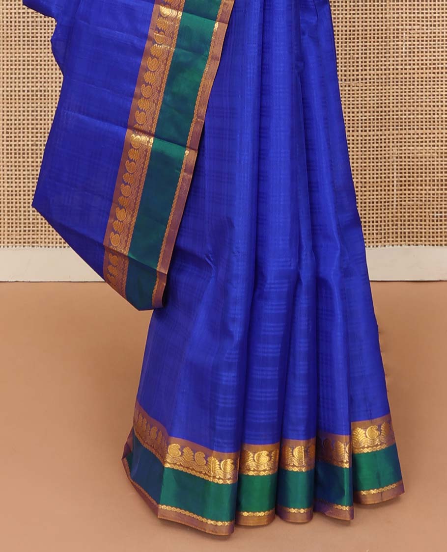 Royal blue checked Kanchipuram silk saree, contrast border of manga, neli, and diamond designs, and striped pallu