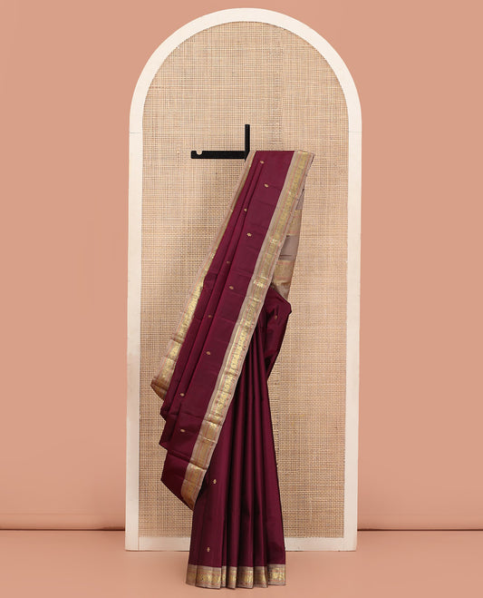 Maroon Kanchipuram Silk Saree Embellished with Zari Buttas, Complemented by Contrast Border of Thilakam Mokku, Muthu, Rudraksham, Manga, and Mayil Designs, Subtly Sparkled Pallu, and Paired with a Contrast Blouse