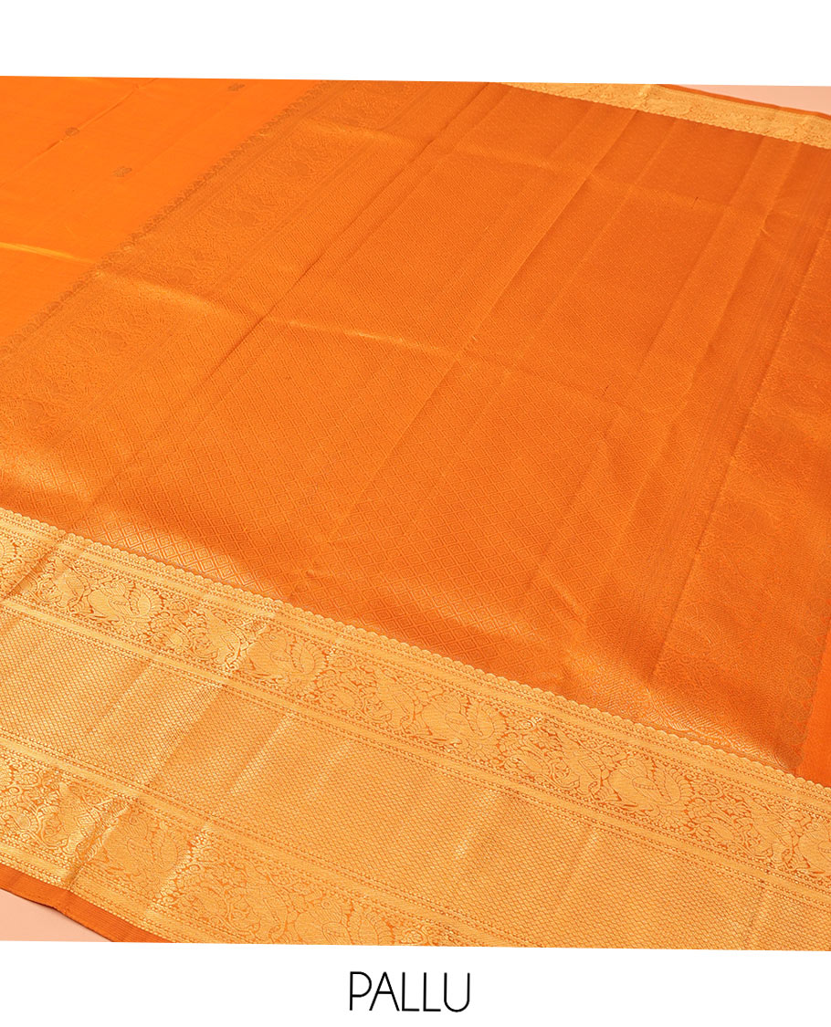Orange Kanchipuram Silk Saree, Decked Up with Mayil Buttas All Over Its Body, Highlighted by Zari Border of Salngai, Mayil, Yaanai, and Mayil Kann Designs, Subtly Enriched Jaal Pallu, and Paired with a Matching Blouse