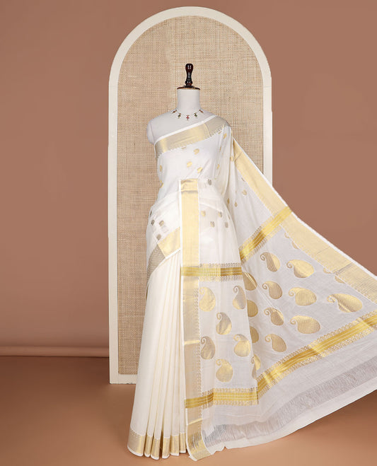 Cream paisley buttas Kerala saree, zari border, and pallu of paisleys in zari