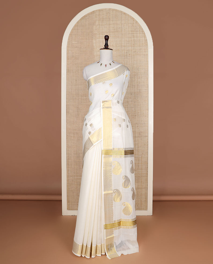 Cream paisley buttas Kerala saree, zari border, and pallu of paisleys in zari